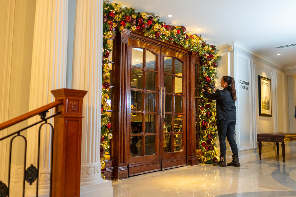 Decorative Christmas garland on a door in London hotel