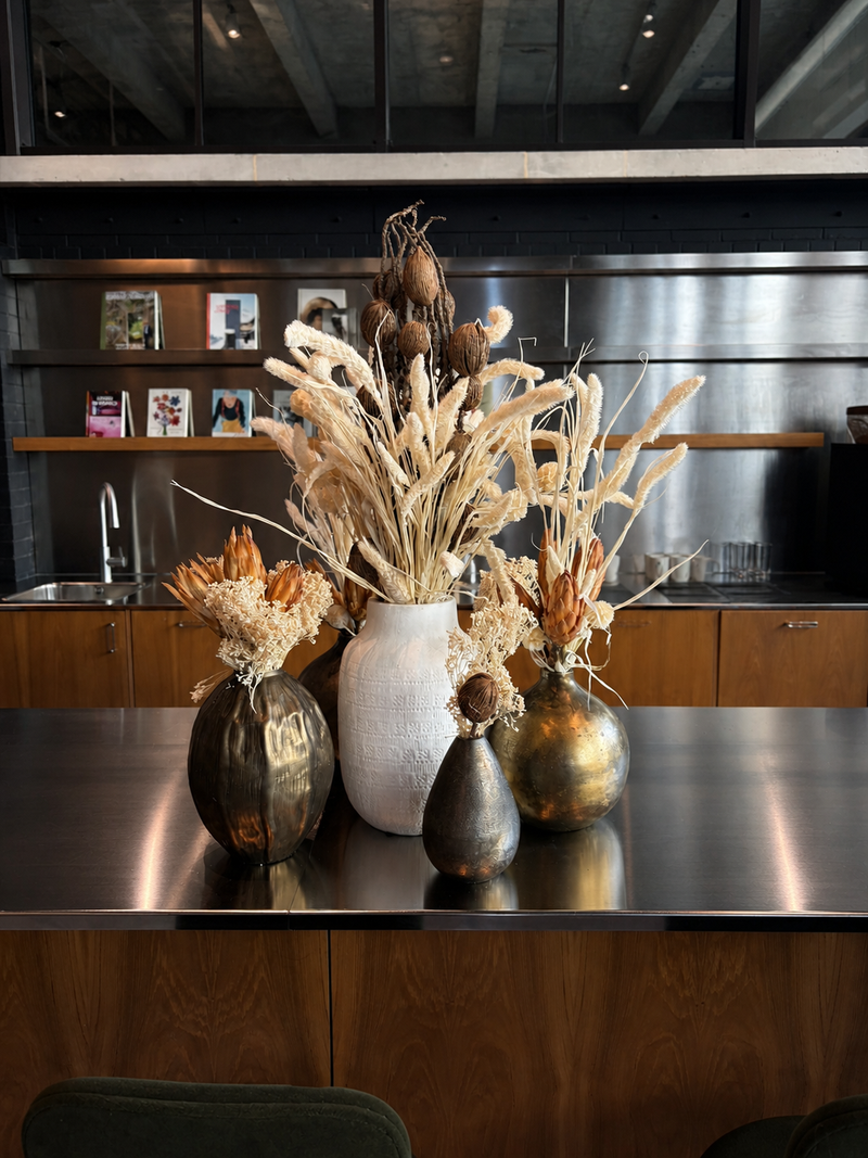 Decorative arrangement of dried plants in vases in london office